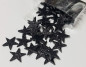 Preview: 16 schwarze Glitzer-Streusterne Ø 3 cm