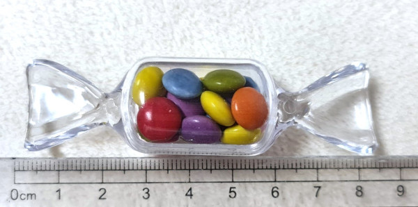 Bonbon aus Kunststoff mit Schokolinsen - Kindergastgeschenk Bonbon aus Kunststoff mit Schokolinsen - Kindergastgeschenk