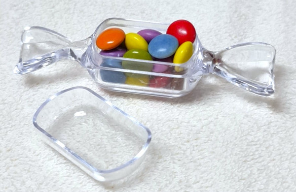 Bonbon aus Kunststoff mit Schokolinsen - Kindergastgeschenk Bonbon aus Kunststoff mit Schokolinsen - Kindergastgeschenk